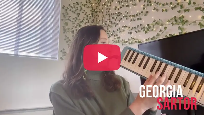 Scholarship winner video thumbnail for Georgia Anton playing a keyboard.