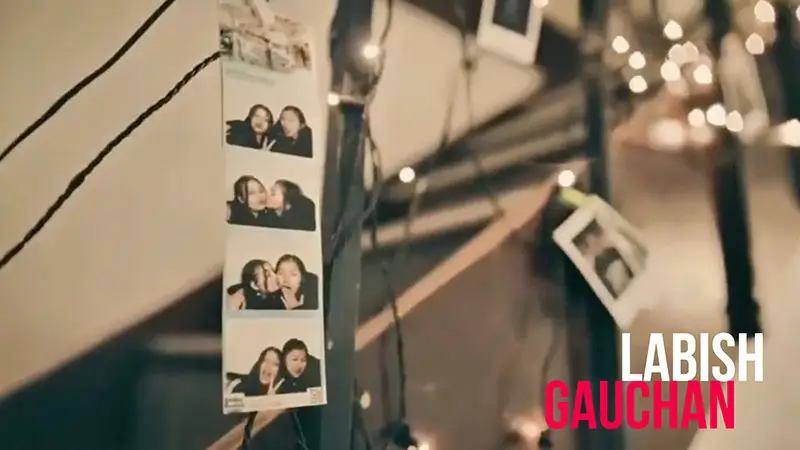 Scholarship winner Labish Gauchan, beside a strip of photo-booth pictures.