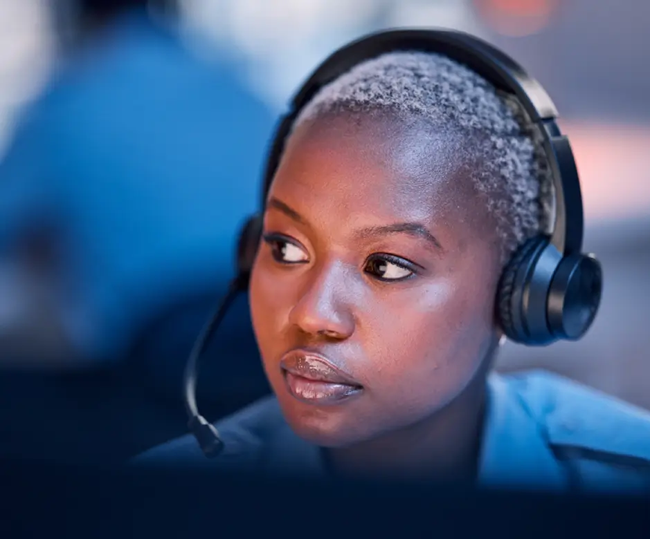 A support agent wearing a headset while working.